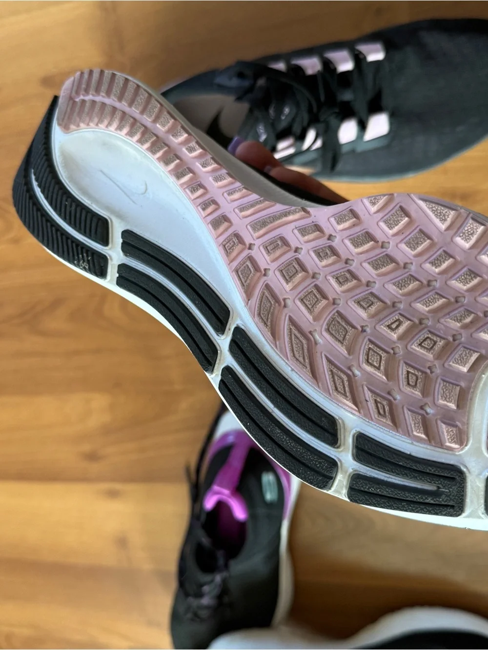 Nike Black Athletic Sneakers with Light Pink Accents